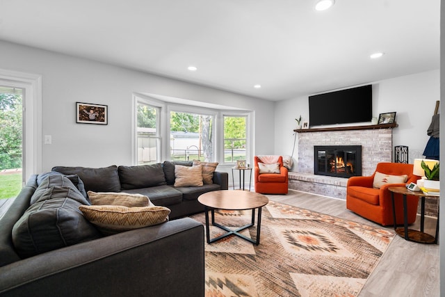 160 Cherry St, Milan, MI 48160 - living room with wood finished floors, healthy amount of natural light, a fireplace, and recessed lighting
