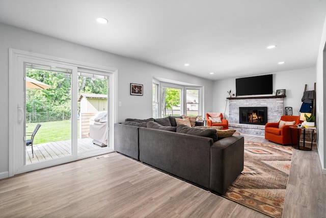 160 Cherry St, Milan, MI 48160 - living area with wood finished floors, a fireplace, and recessed lighting
