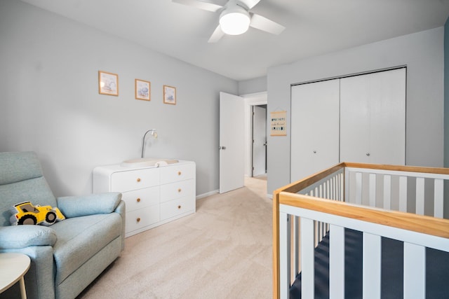 160 Cherry St, Milan, MI 48160 - bedroom with light colored carpet, a closet, a crib, and ceiling fan