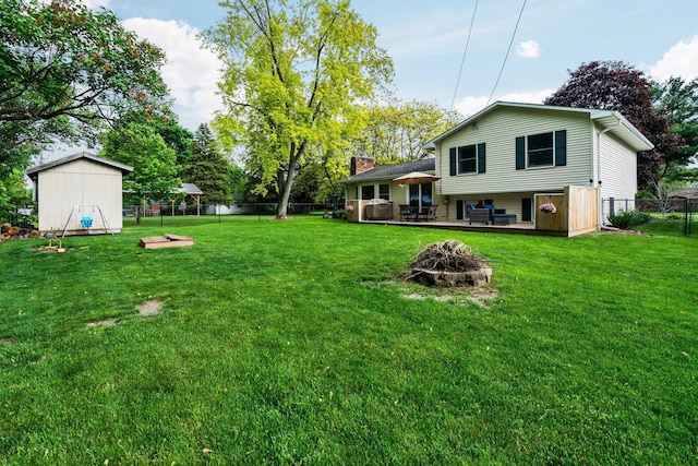 160 Cherry St, Milan, MI 48160 - view of yard with an outdoor fire pit and a wooden deck