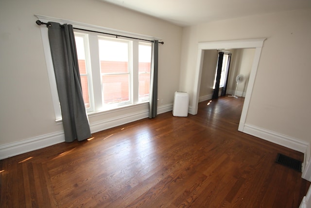 212 Rose Pl, Kalamazoo, MI 49001 - unfurnished room featuring dark wood-style flooring and baseboards