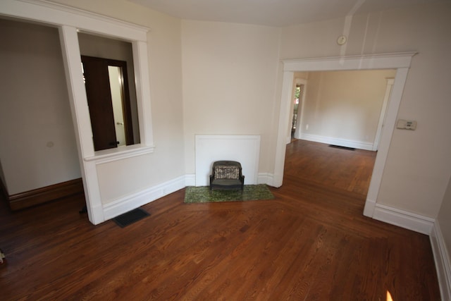 212 Rose Pl, Kalamazoo, MI 49001 - unfurnished living room with wood finished floors and baseboards