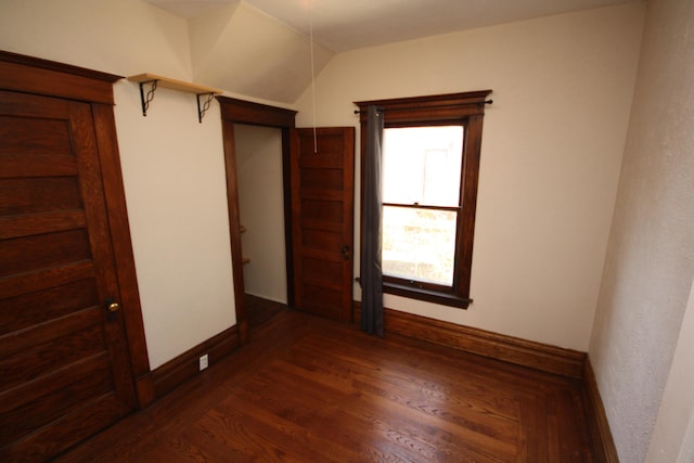 212 Rose Pl, Kalamazoo, MI 49001 - unfurnished bedroom with dark wood-style floors and baseboards