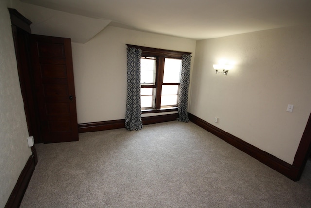 212 Rose Pl, Kalamazoo, MI 49001 - carpeted empty room with baseboards