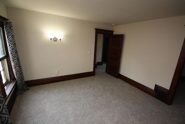 212 Rose Pl, Kalamazoo, MI 49001 - unfurnished room with carpet flooring and baseboards