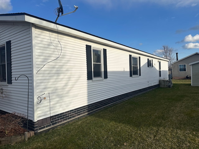 33332 Fern Ct, Lenox, MI 48048 - view of property exterior with a lawn and central AC