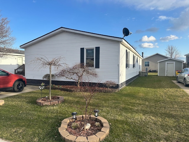 33332 Fern Ct, Lenox, MI 48048 - view of home's exterior featuring a yard, a shed, and an outbuilding