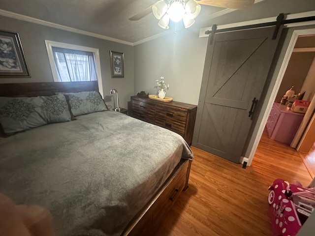 33332 Fern Ct, Lenox, MI 48048 - bedroom with a barn door, ornamental molding, light wood-type flooring, and a ceiling fan