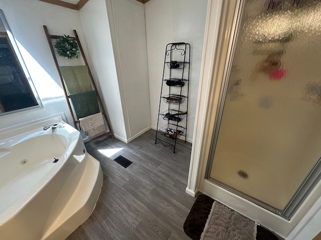 33332 Fern Ct, Lenox, MI 48048 - bathroom featuring a shower stall, wood finished floors, a whirlpool tub, and baseboards
