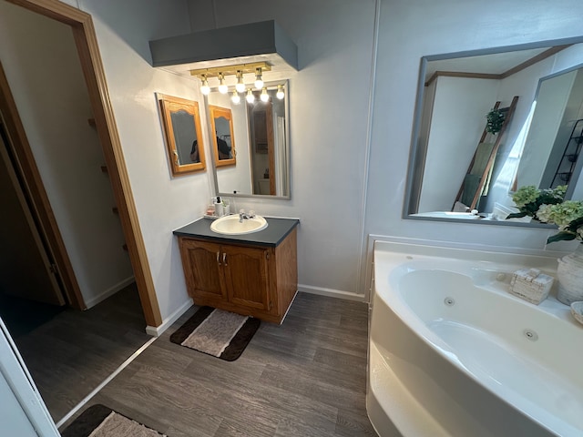 33332 Fern Ct, Lenox, MI 48048 - full bath featuring wood finished floors, a whirlpool tub, vanity, and baseboards