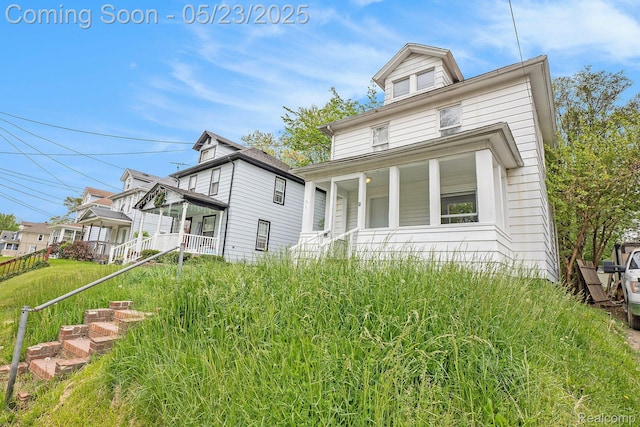 54 Hudson Ave, Pontiac, MI 48342 - view of side of home featuring a porch
