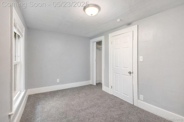 54 Hudson Ave, Pontiac, MI 48342 - unfurnished bedroom with carpet flooring, baseboards, and a closet
