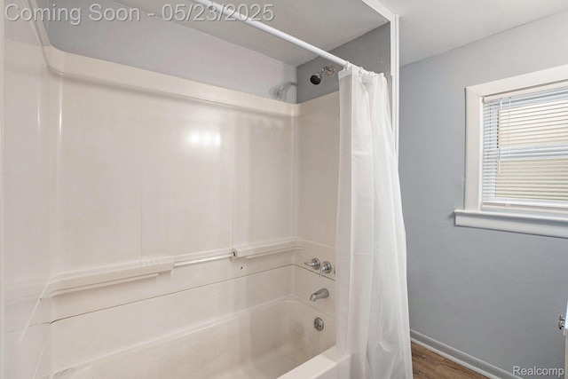 54 Hudson Ave, Pontiac, MI 48342 - bathroom featuring shower / tub combo, baseboards, and wood finished floors