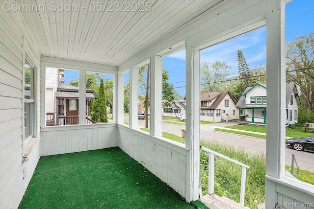 54 Hudson Ave, Pontiac, MI 48342 - unfurnished sunroom with a residential view