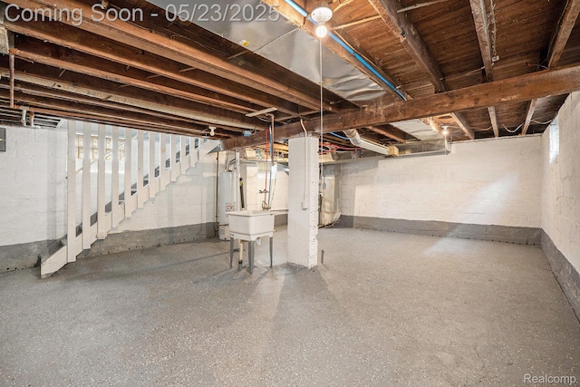 54 Hudson Ave, Pontiac, MI 48342 - unfinished basement with gas water heater and a sink