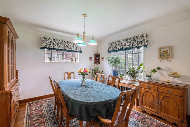 1602 Linwood Ave, Flint, MI 48503 - dining area with wood finished floors, baseboards, and a chandelier