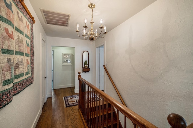 1602 Linwood Ave, Flint, MI 48503 - corridor with an upstairs landing, a chandelier, wood finished floors, and baseboards