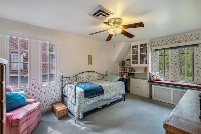 1602 Linwood Ave, Flint, MI 48503 - bedroom featuring radiator, carpet flooring, and a ceiling fan