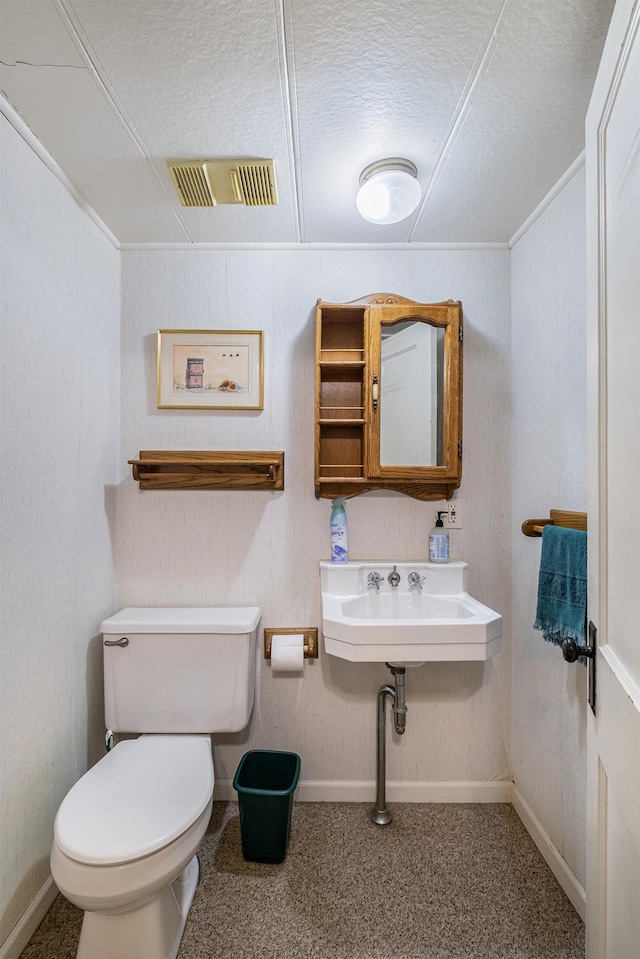1602 Linwood Ave, Flint, MI 48503 - bathroom with toilet, crown molding, a textured ceiling, and baseboards