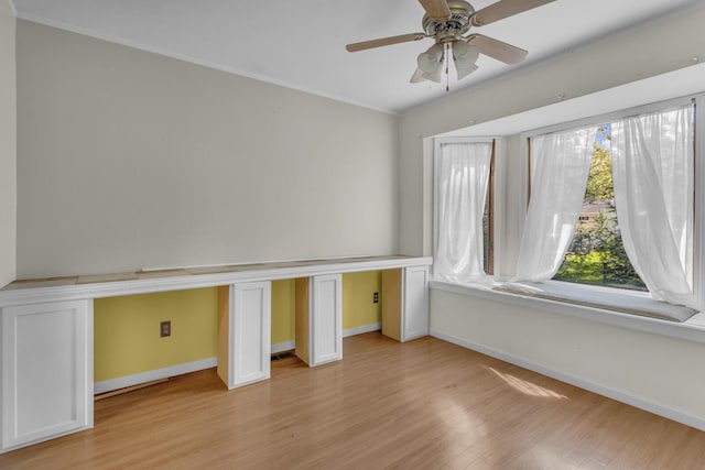 11317 N Dr, Brooklyn, MI 49230 - unfurnished bedroom with baseboards, light wood finished floors, ornamental molding, and ceiling fan
