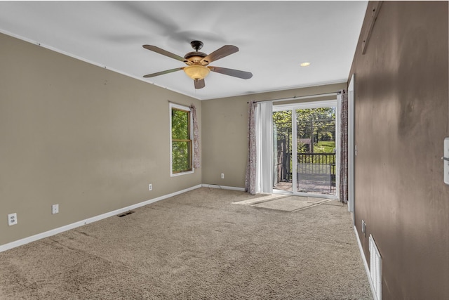 11317 N Dr, Brooklyn, MI 49230 - empty room with healthy amount of natural light, baseboards, carpet, and ceiling fan