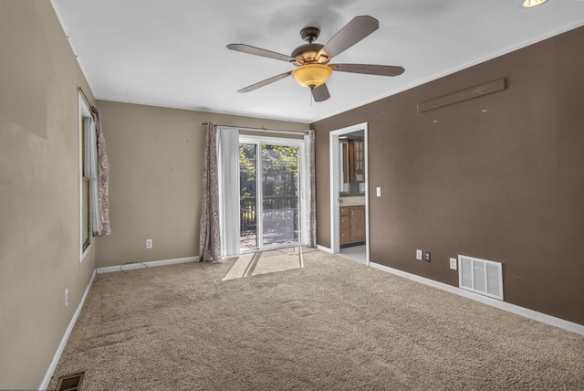 11317 N Dr, Brooklyn, MI 49230 - carpeted empty room featuring a ceiling fan and baseboards