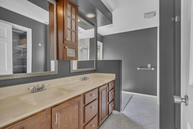 11317 N Dr, Brooklyn, MI 49230 - bathroom with tile patterned flooring, double vanity, baseboards, and a shower with door