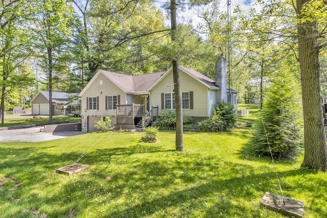 11317 N Dr, Brooklyn, MI 49230 - ranch-style house featuring a chimney, a garage, a front yard, and a wooden deck