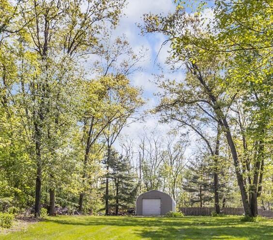 11317 N Dr, Brooklyn, MI 49230 - view of yard with a garage and an outbuilding