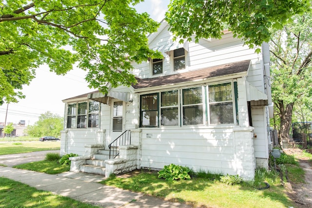 view of front of home featuring a shingled roof