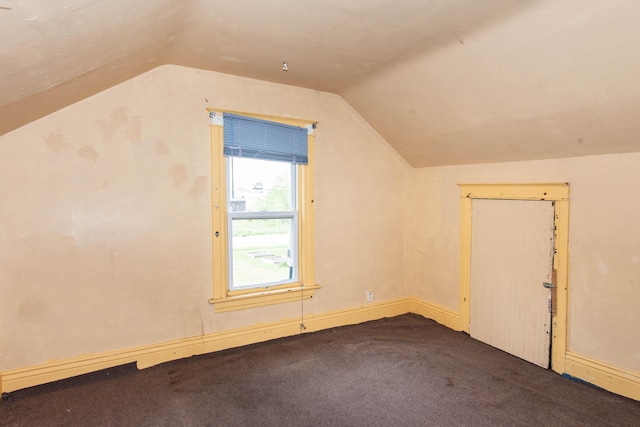 bonus room featuring vaulted ceiling, carpet floors, and baseboards