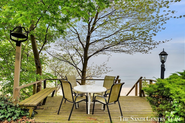 wooden terrace with outdoor dining space