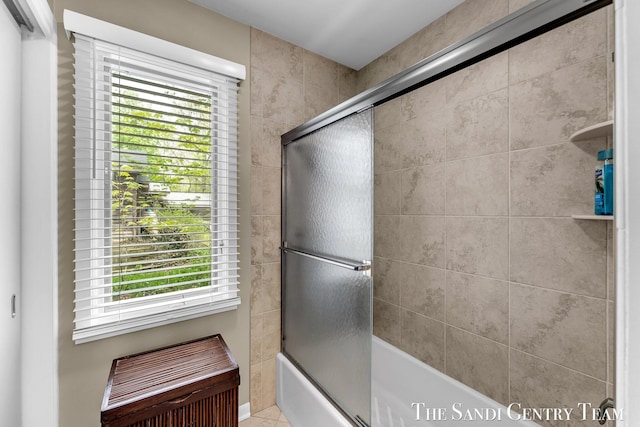 full bath featuring enclosed tub / shower combo and tile patterned floors