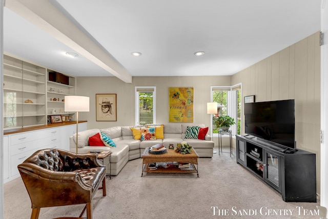 carpeted living area featuring plenty of natural light and recessed lighting