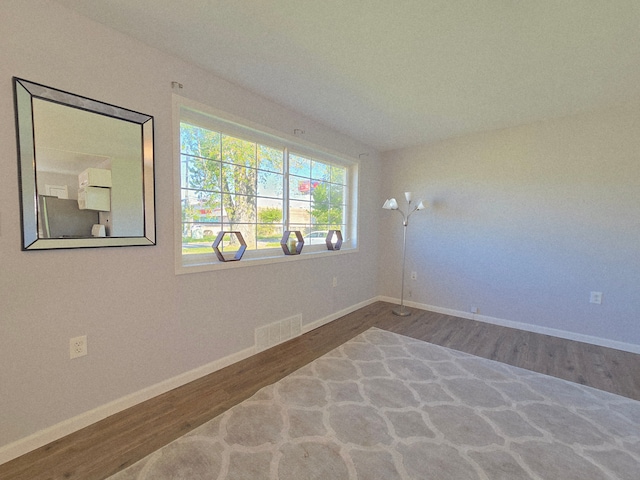 18453 Woodbine St, Detroit, MI 48219 - empty room featuring wood finished floors and baseboards