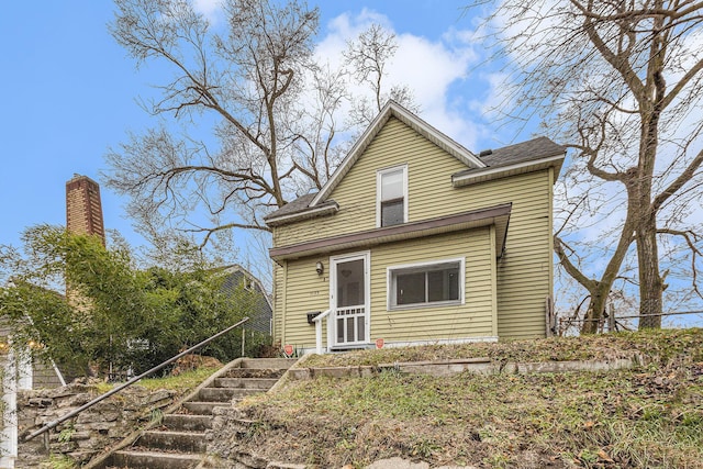view of front of house featuring stairway