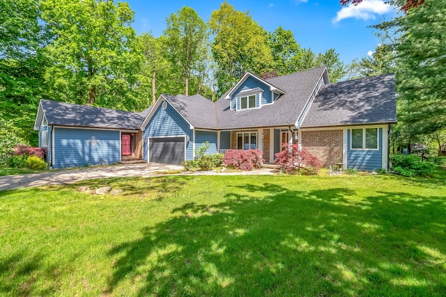 new england style home with a garage, a front lawn, concrete driveway, a shingled roof, and a porch