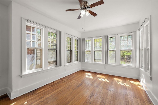 1199 Atkinson St, Detroit, MI 48202 - unfurnished sunroom featuring baseboards and hardwood / wood-style floors