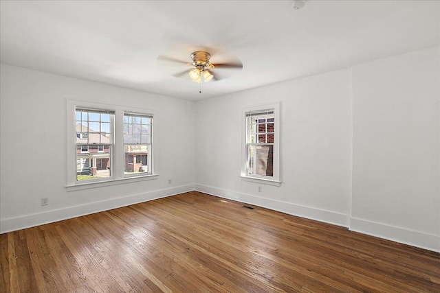 1199 Atkinson St, Detroit, MI 48202 - empty room featuring baseboards, wood finished floors, and a ceiling fan