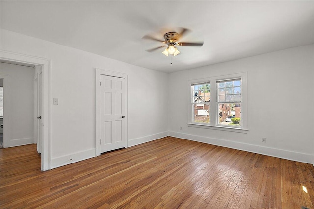 1199 Atkinson St, Detroit, MI 48202 - empty room with a ceiling fan, light wood finished floors, and baseboards