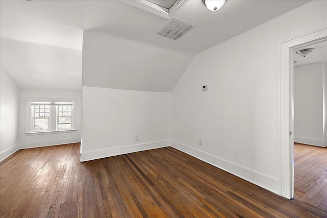1199 Atkinson St, Detroit, MI 48202 - bonus room featuring lofted ceiling, dark wood-style floors, and baseboards