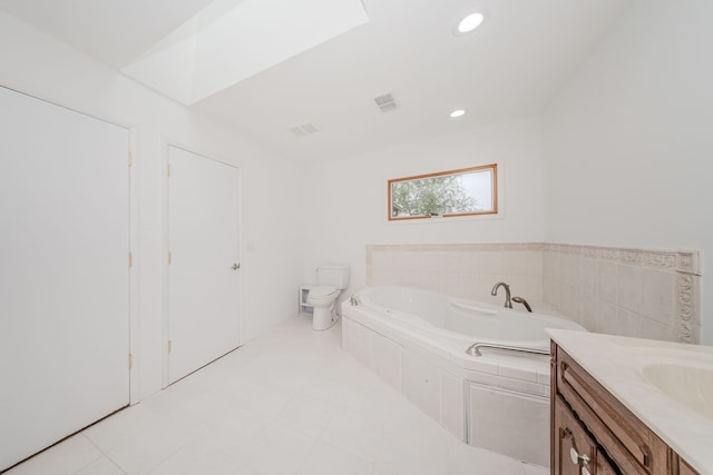 bathroom featuring a bath, toilet, recessed lighting, and vanity
