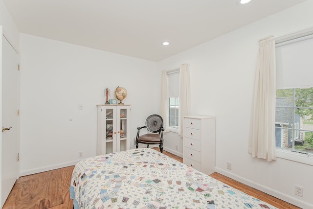 bedroom featuring baseboards, recessed lighting, and light wood-style floors