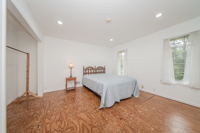 bedroom featuring recessed lighting, baseboards, and wood finished floors