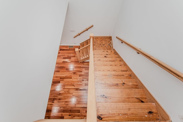 stairs with wood finished floors