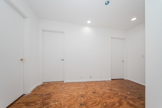 unfurnished room featuring recessed lighting