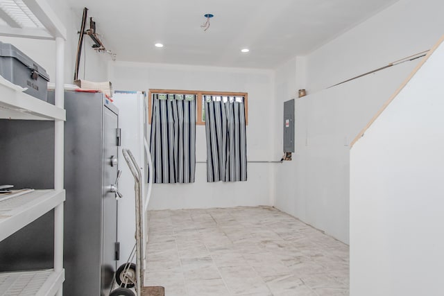 corridor featuring recessed lighting and electric panel