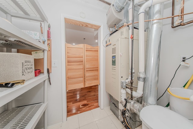 bathroom with tile patterned flooring and toilet