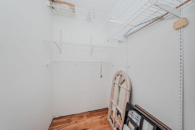 spacious closet with light wood-style floors