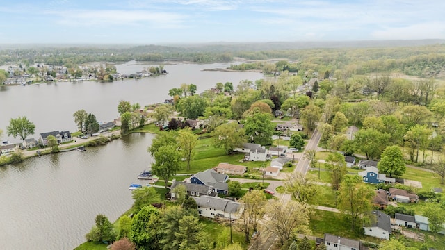 aerial view of residential area featuring a large body of water